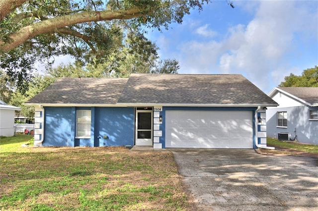 ranch-style house with a front lawn, central AC unit, and a garage