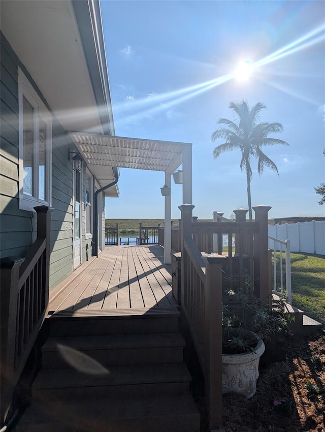 wooden terrace with a pergola