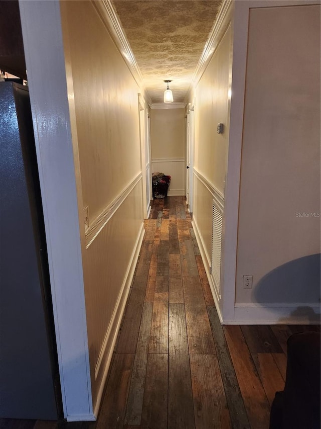 hall featuring dark hardwood / wood-style floors and ornamental molding