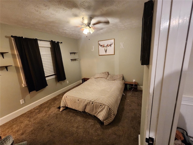 carpeted bedroom featuring ceiling fan and a textured ceiling