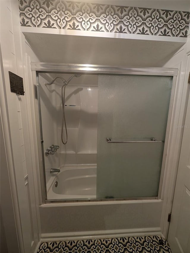 bathroom featuring enclosed tub / shower combo and tile patterned floors