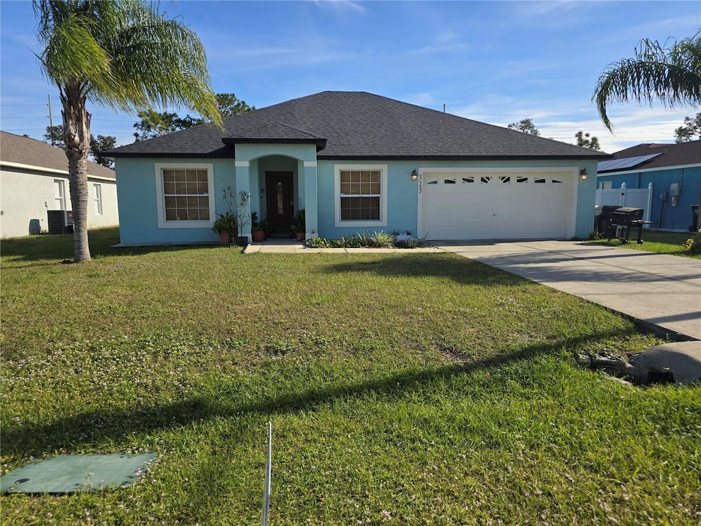 single story home with central AC unit, a garage, and a front lawn