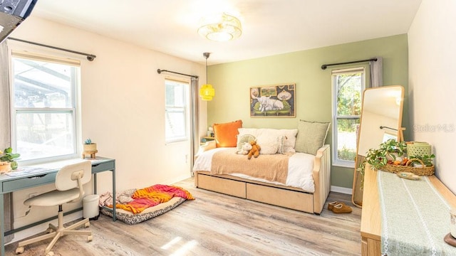 bedroom with hardwood / wood-style floors