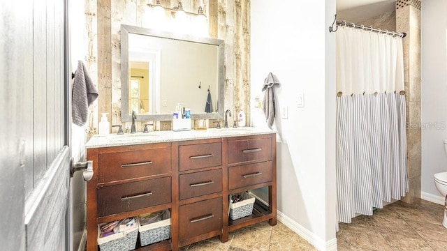 bathroom with vanity and toilet