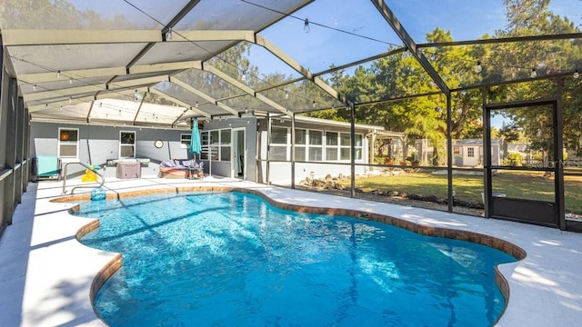 view of swimming pool with a patio, a lanai, and a sunroom