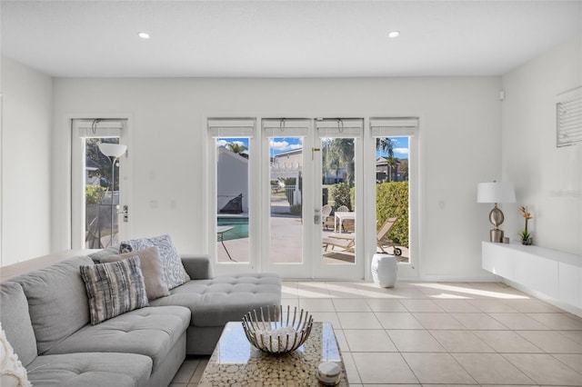 tiled living room featuring french doors