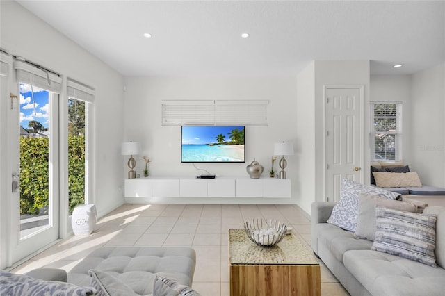 tiled living room with plenty of natural light