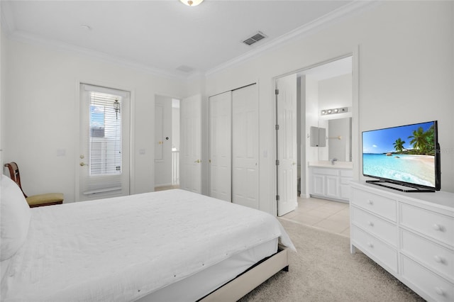 bedroom featuring connected bathroom, light colored carpet, and ornamental molding