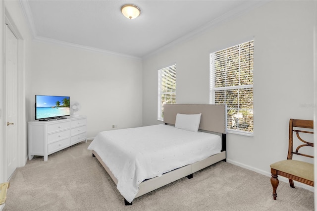 bedroom featuring ornamental molding and light carpet