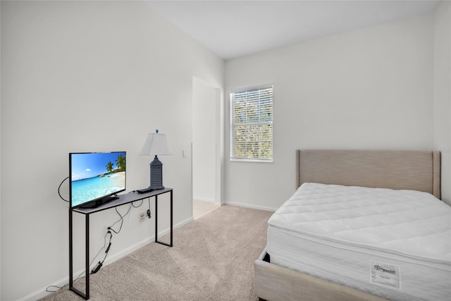 bedroom with light colored carpet