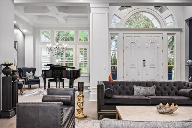 living room featuring an inviting chandelier, coffered ceiling, beam ceiling, and crown molding