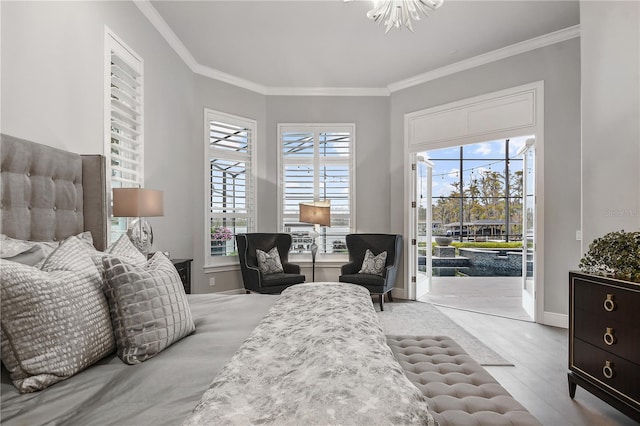 bedroom with crown molding, access to outside, and light hardwood / wood-style floors