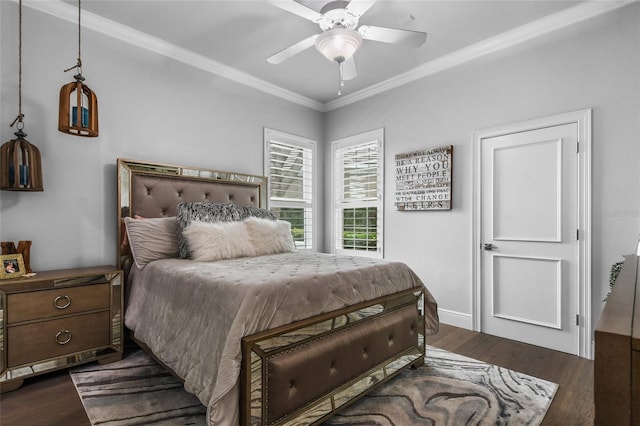 bedroom with dark wood-type flooring, ceiling fan, and crown molding