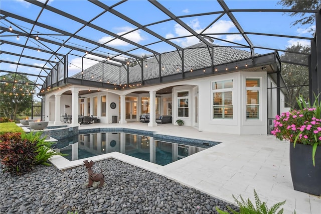 view of swimming pool featuring a lanai, a patio, ceiling fan, and an in ground hot tub