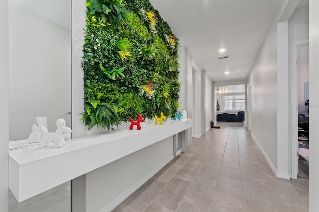 hallway with light tile patterned flooring