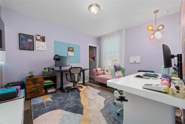 office featuring a chandelier and dark wood-type flooring