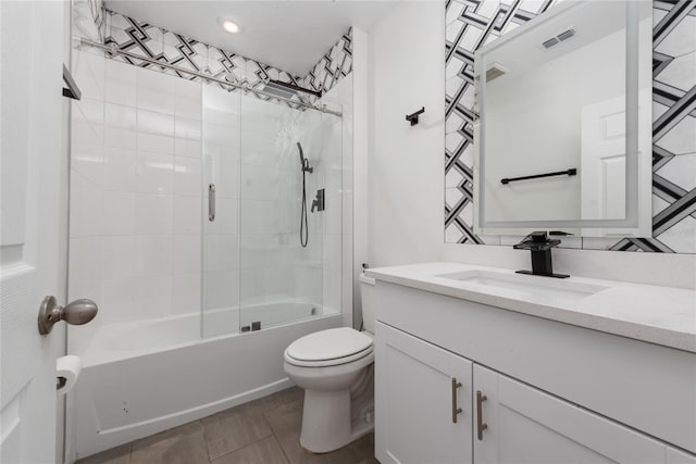 full bathroom with decorative backsplash, vanity, toilet, and tiled shower / bath