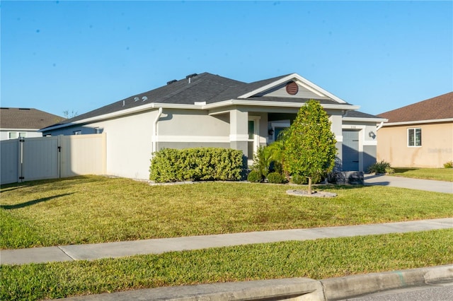 view of front facade with a front yard and a garage