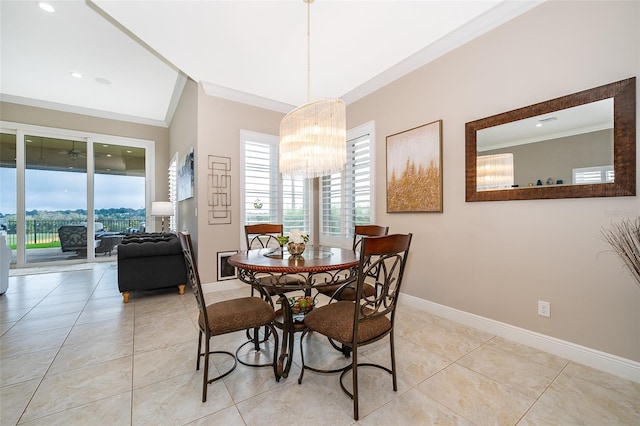 dining room featuring ornamental molding, light tile patterned floors, and a chandelier