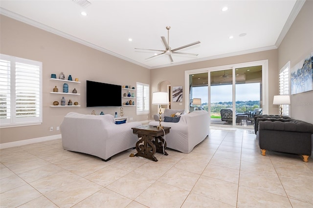 living room with ceiling fan, light tile patterned floors, and crown molding