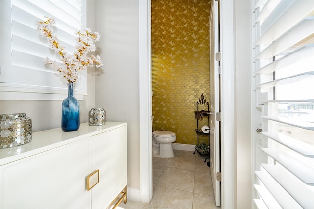 bathroom featuring toilet and tile patterned floors