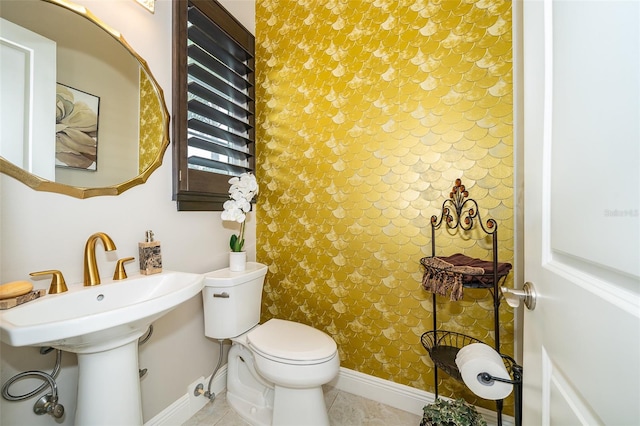 bathroom featuring tile patterned floors and toilet