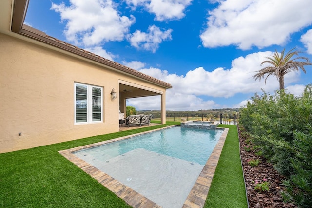 view of pool with a lawn and a patio area