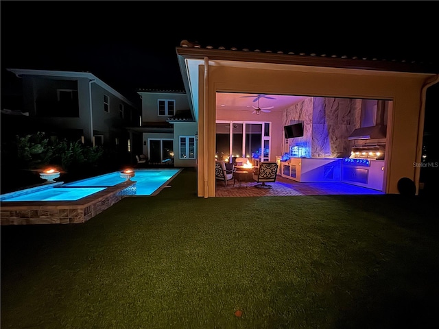 view of swimming pool featuring a yard and a patio area