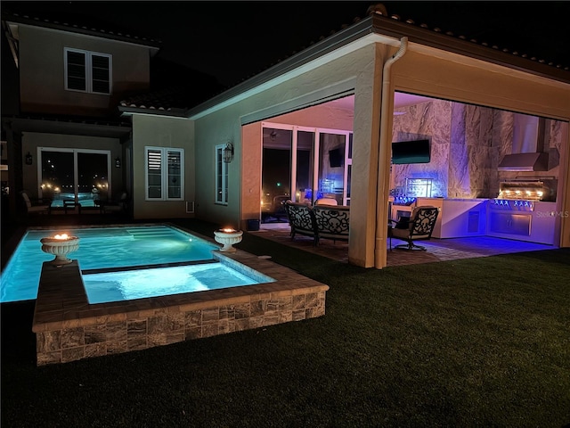 view of swimming pool with a patio area and an in ground hot tub