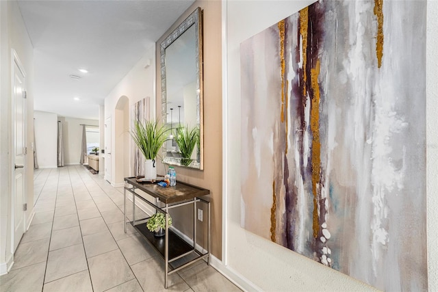 hallway featuring light tile patterned floors