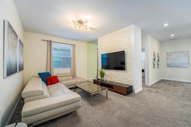 carpeted living room featuring a textured ceiling