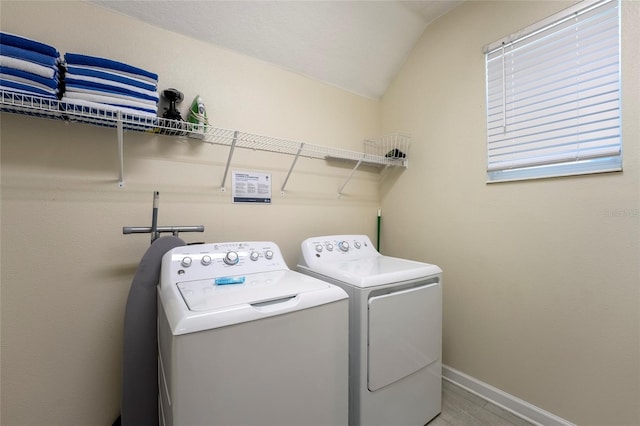 washroom featuring washing machine and dryer