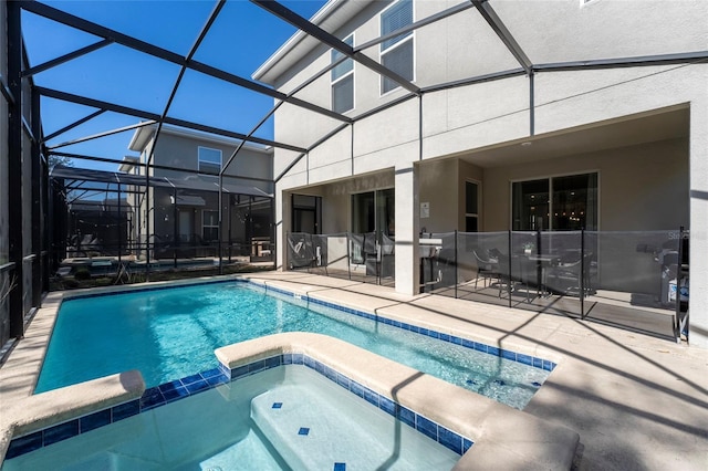 view of swimming pool featuring a lanai, an in ground hot tub, and a patio