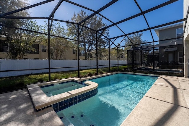 view of pool featuring an in ground hot tub and glass enclosure