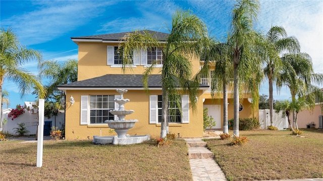 view of front of property featuring a front yard