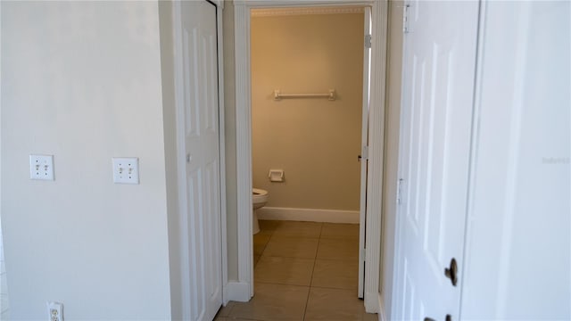 bathroom with tile patterned floors and toilet