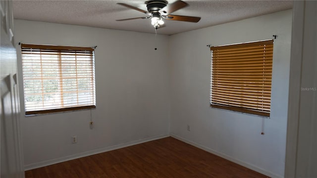 spare room featuring hardwood / wood-style flooring, ceiling fan, and a textured ceiling