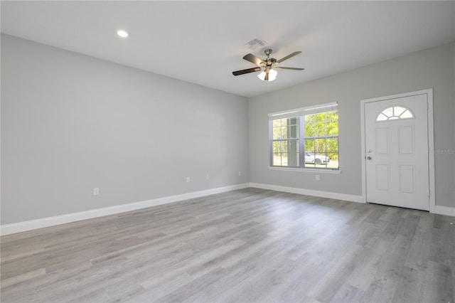 foyer featuring ceiling fan and light hardwood / wood-style floors