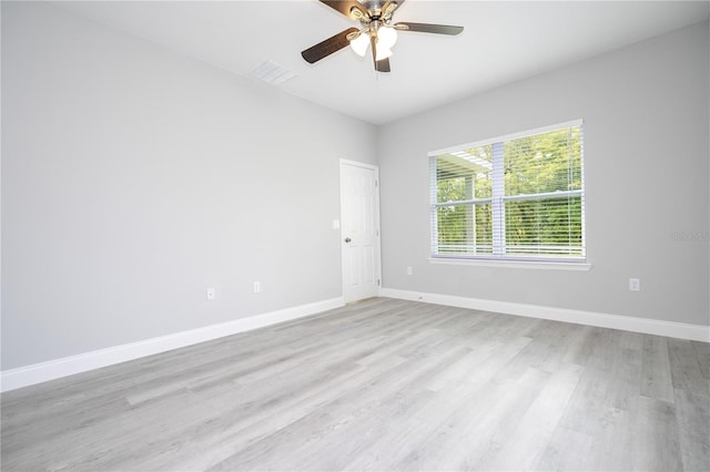 unfurnished room featuring ceiling fan and light wood-type flooring