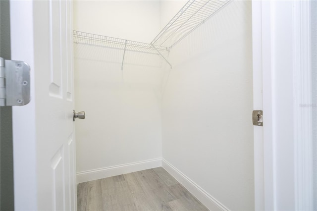 walk in closet featuring light wood-type flooring