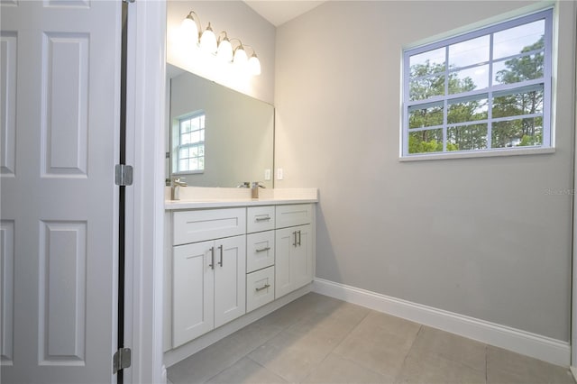 bathroom with vanity and tile patterned floors