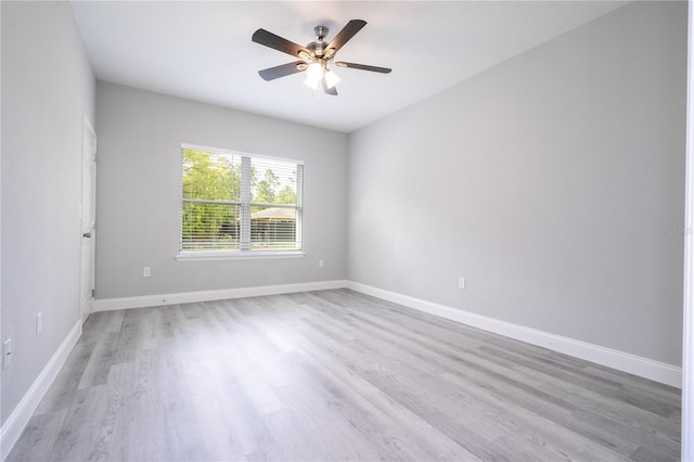 spare room with ceiling fan and light hardwood / wood-style flooring