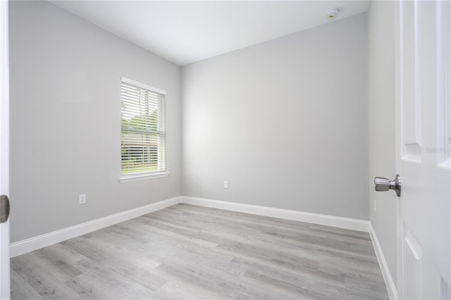 unfurnished room with light hardwood / wood-style floors