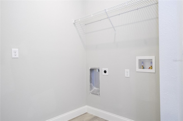 washroom featuring hookup for an electric dryer, hardwood / wood-style flooring, and washer hookup