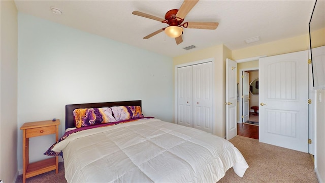 carpeted bedroom with a closet and ceiling fan