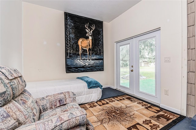 entryway with carpet floors and french doors