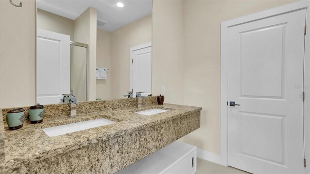 bathroom featuring vanity and walk in shower