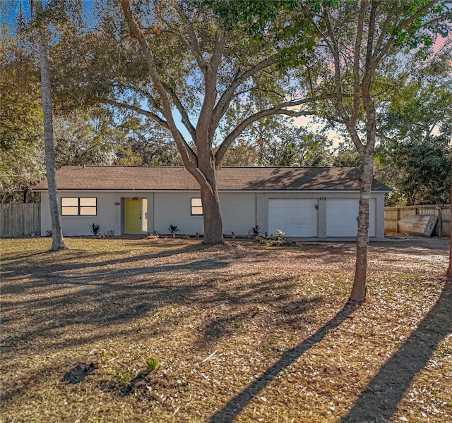 ranch-style house featuring a garage