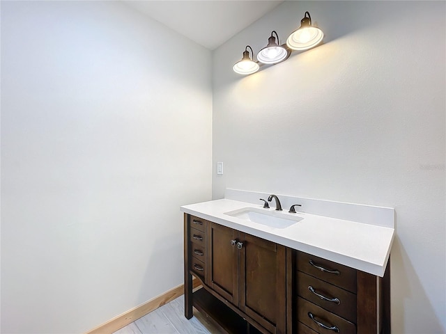 bathroom featuring hardwood / wood-style floors and vanity