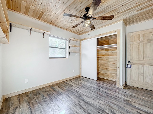 unfurnished bedroom featuring hardwood / wood-style floors, ceiling fan, and wooden ceiling